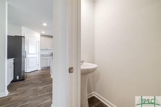 bathroom with hardwood / wood-style floors and sink