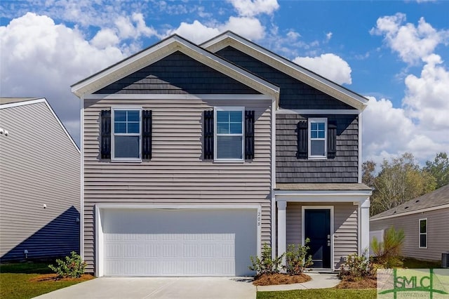 view of front of home with a garage and central air condition unit