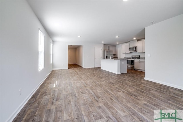 unfurnished living room featuring light wood-type flooring