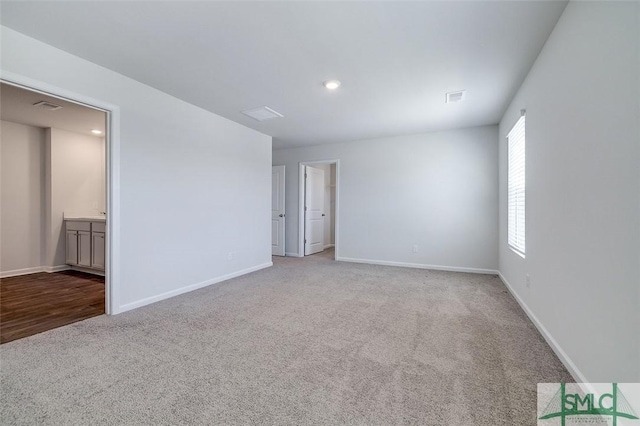 unfurnished room with light colored carpet