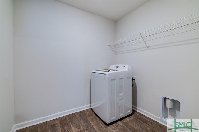 washroom with washer / dryer and dark hardwood / wood-style floors