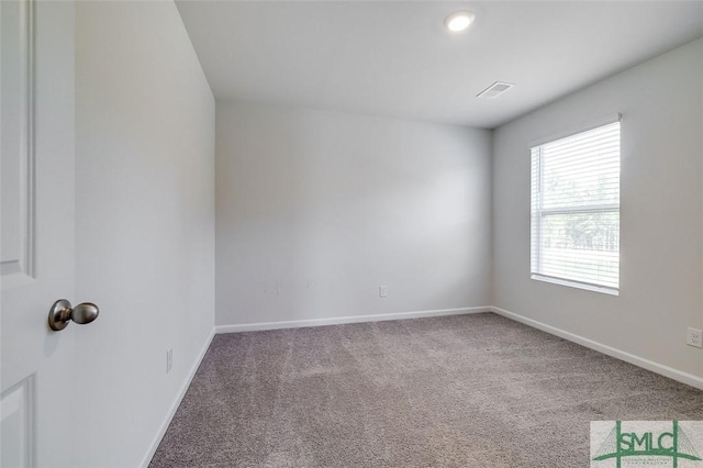 empty room with carpet flooring