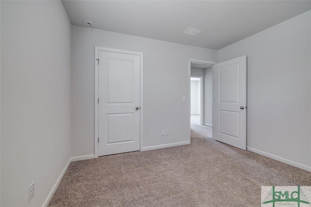 spare room with light colored carpet