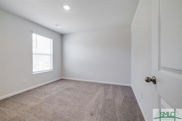 spare room featuring carpet flooring