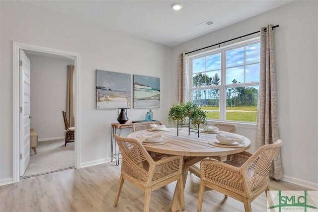 dining room with light wood-type flooring