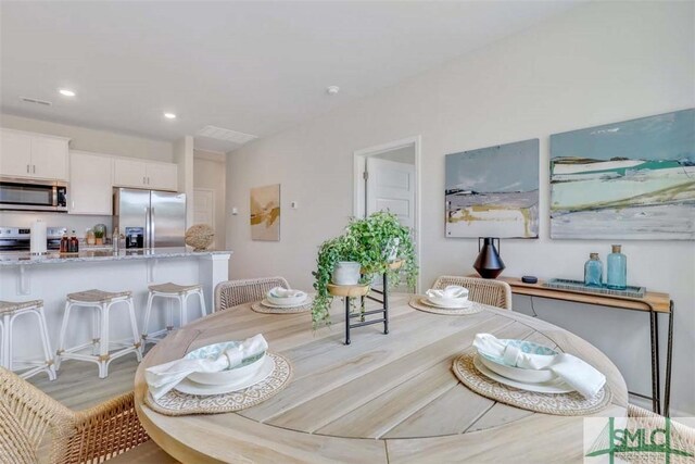 dining space featuring light hardwood / wood-style floors