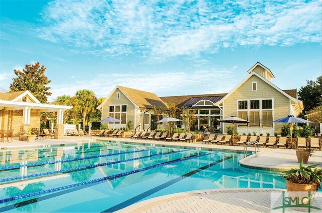 view of swimming pool with a patio area