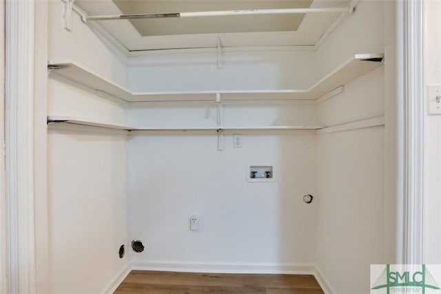 clothes washing area featuring washer hookup, hookup for an electric dryer, and hardwood / wood-style floors