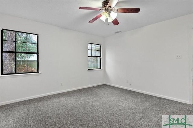 unfurnished room with carpet floors and ceiling fan