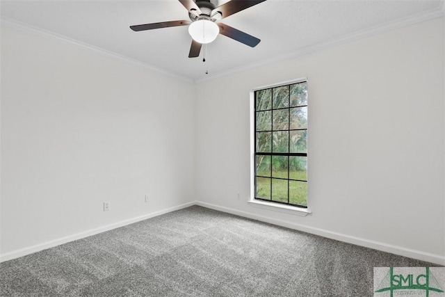 carpeted empty room with ornamental molding, a healthy amount of sunlight, and ceiling fan