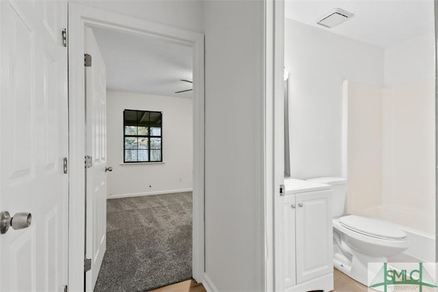 bathroom featuring vanity and toilet