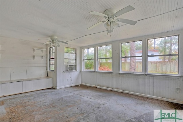 unfurnished sunroom with cooling unit and ceiling fan