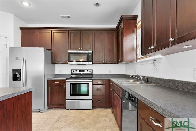 kitchen with sink and appliances with stainless steel finishes