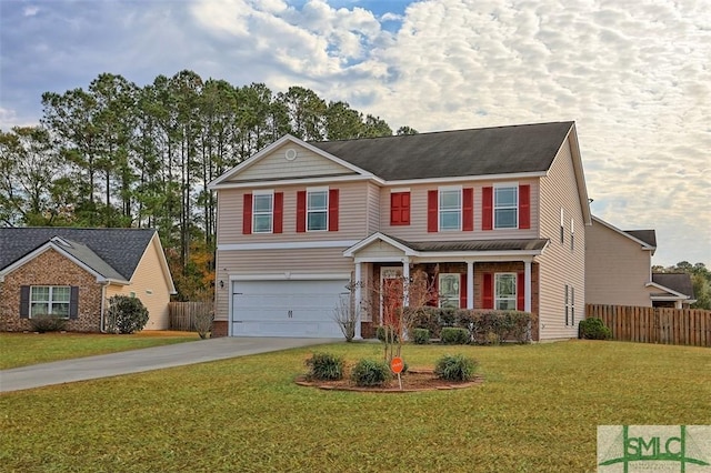 view of front of property with a front yard and a garage