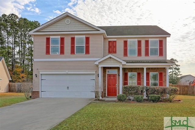 view of front facade with a garage and a front lawn