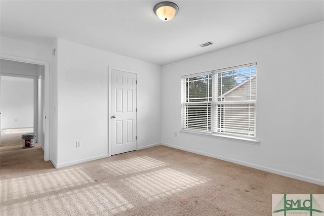 unfurnished bedroom with a closet and carpet