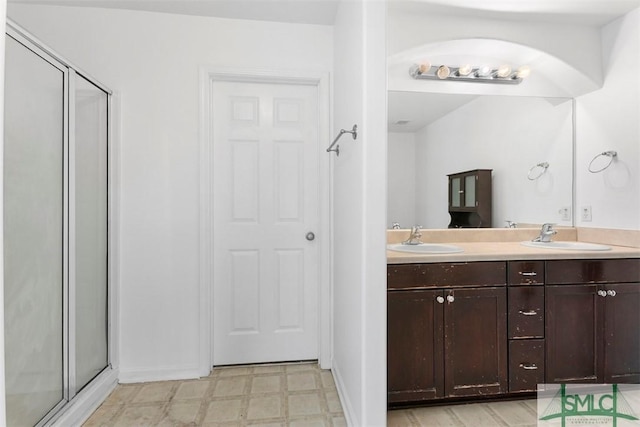 bathroom with vanity and walk in shower