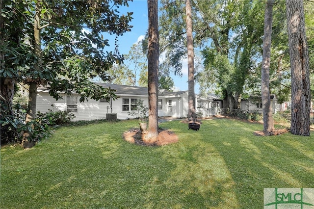 view of yard featuring central AC unit