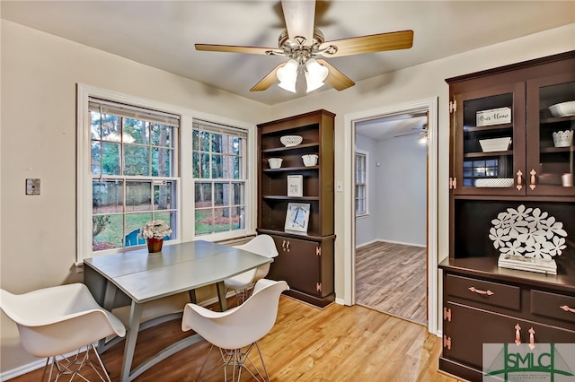 dining room featuring light hardwood / wood-style flooring and ceiling fan