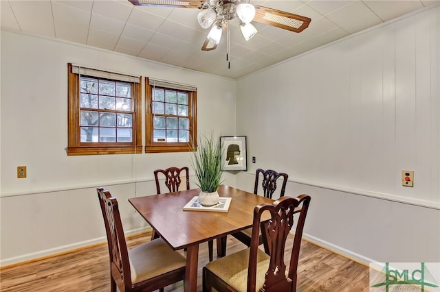 dining room with ceiling fan, light hardwood / wood-style flooring, and crown molding