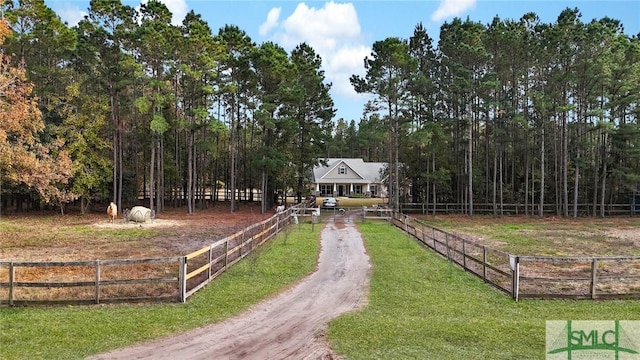 view of property's community with a yard and a rural view