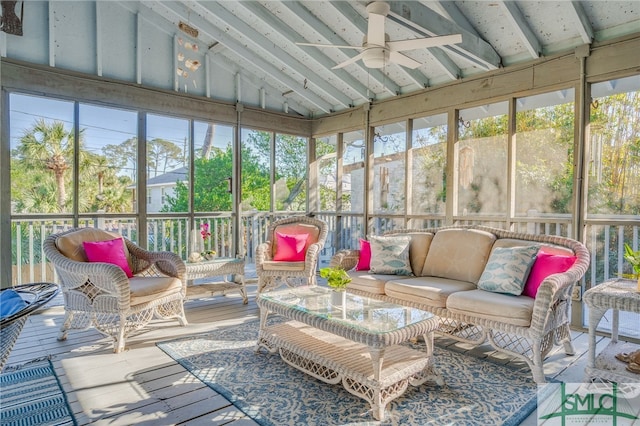 sunroom with ceiling fan and lofted ceiling