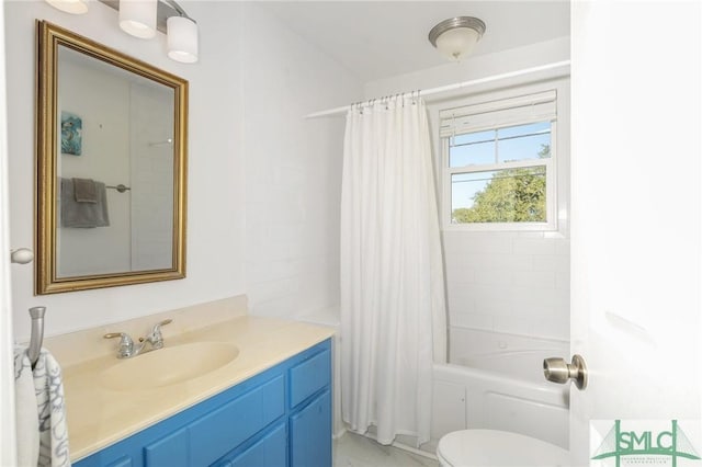 full bathroom with vanity, toilet, and shower / bath combo with shower curtain