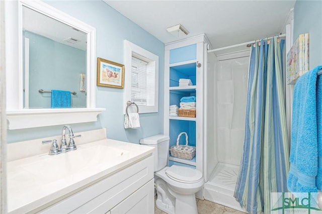 bathroom featuring tile patterned flooring, vanity, curtained shower, and toilet