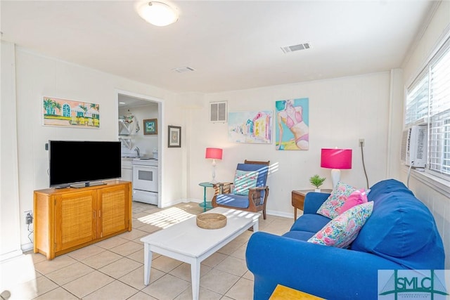 tiled living room featuring cooling unit