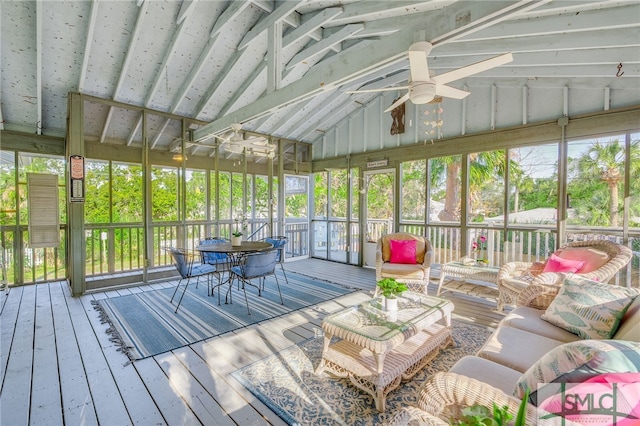 sunroom / solarium featuring ceiling fan and vaulted ceiling