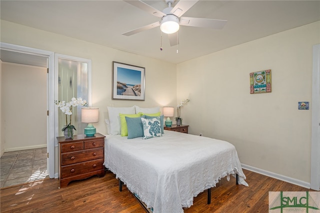 bedroom featuring ceiling fan and dark hardwood / wood-style floors