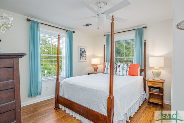 bedroom with hardwood / wood-style floors and ceiling fan