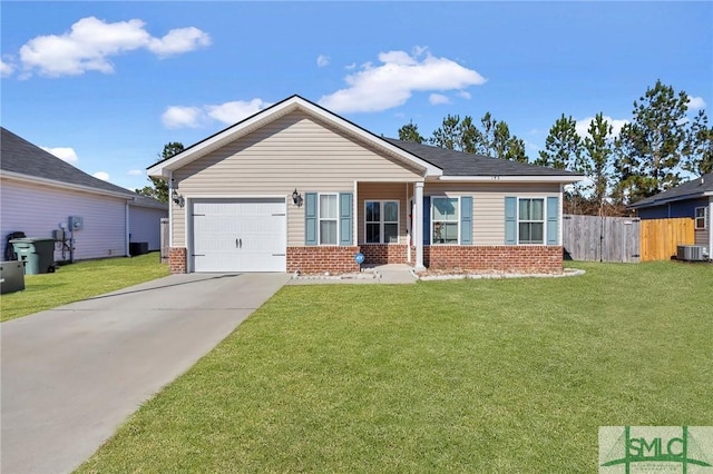 view of front facade featuring a garage, a front yard, and central AC