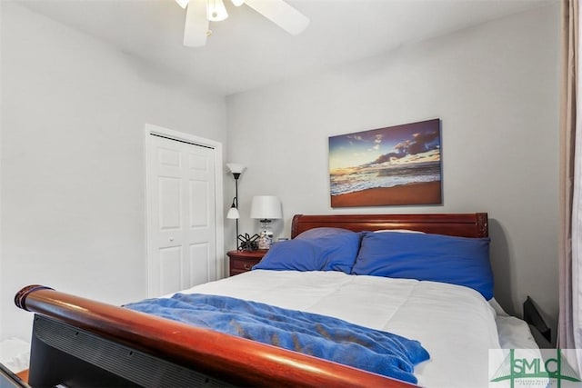 bedroom with ceiling fan and a closet