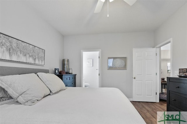 bedroom featuring dark hardwood / wood-style flooring, ceiling fan, and connected bathroom