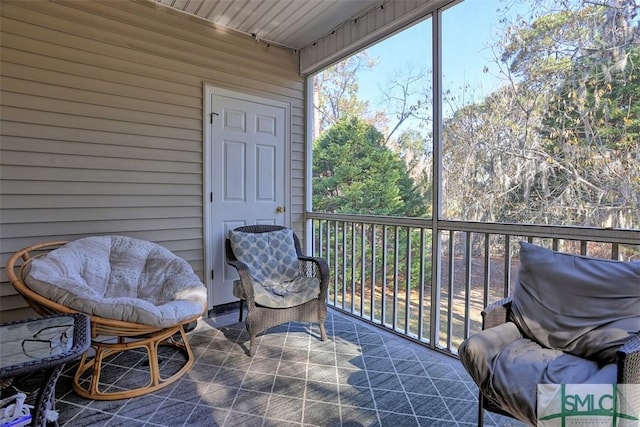 sunroom featuring wooden ceiling