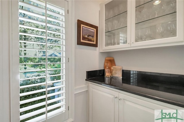 bar with white cabinetry