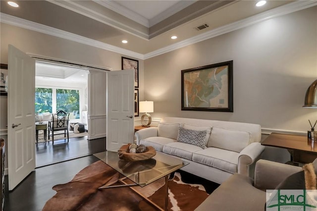 living room featuring crown molding