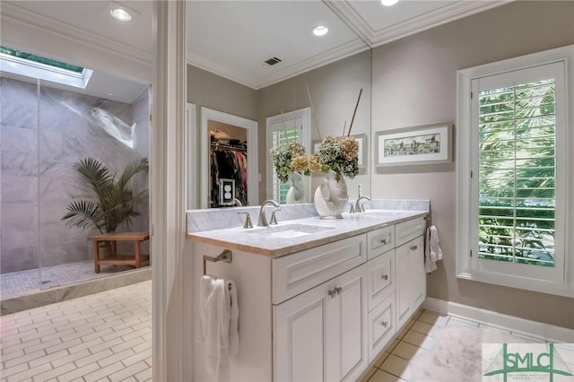 bathroom with tile patterned flooring, vanity, walk in shower, and crown molding