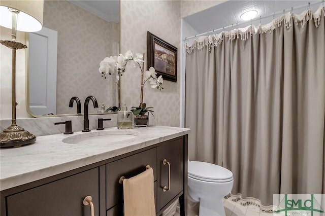 bathroom with vanity and toilet