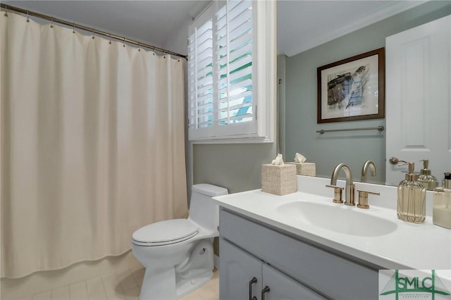 bathroom with tile patterned flooring, vanity, and toilet