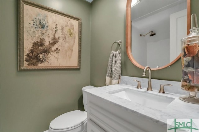 bathroom with vanity and toilet