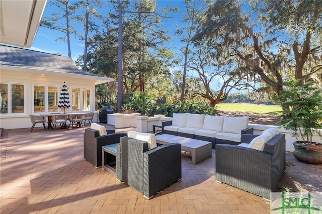 view of patio / terrace with grilling area and an outdoor living space