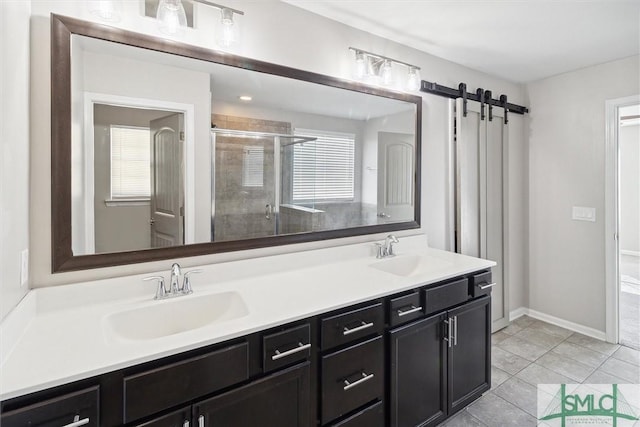 bathroom featuring tile patterned flooring, vanity, and walk in shower