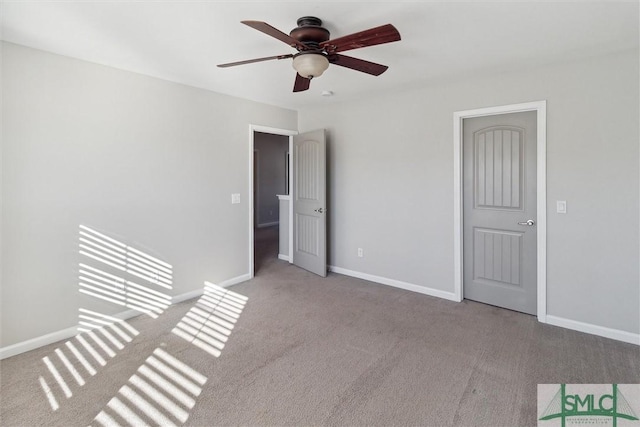 unfurnished bedroom featuring ceiling fan and light colored carpet