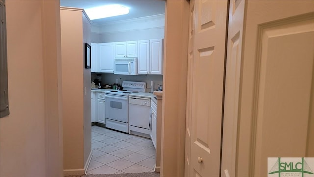 kitchen with white cabinetry, white appliances, ornamental molding, and light tile patterned floors