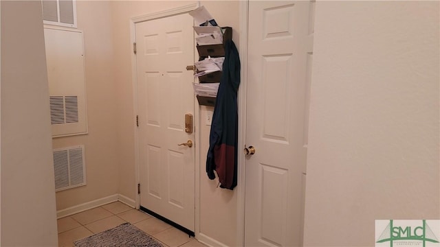 entryway featuring light tile patterned flooring