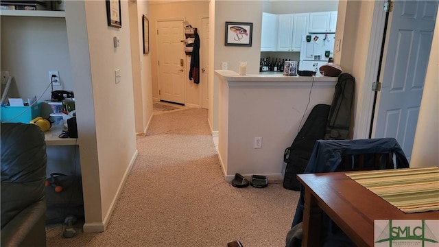 corridor with light colored carpet