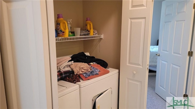 laundry room featuring washing machine and dryer