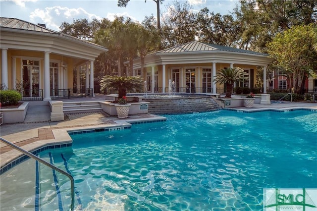 view of pool featuring pool water feature